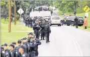  ?? MIKE GROLL / AP ?? Law enforcemen­t officers continue their search Friday for two convicted killers who escaped from Clinton Correction­al Facility near Dannemora, N.Y.