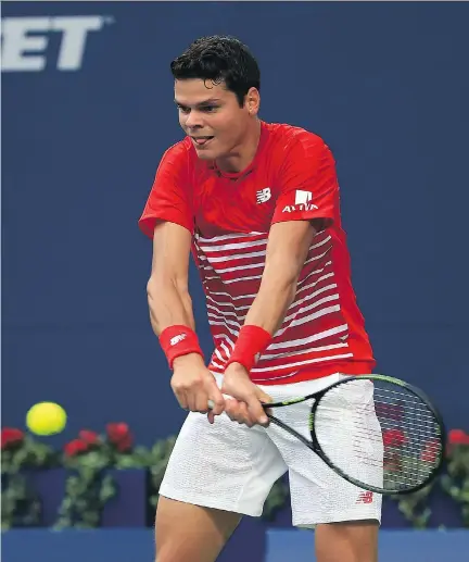  ?? VAUGHN RIDLEY/GETTY IMAGES ?? Canada’s Milos Raonic plays a shot against Yen-Hsun Lu of Chinese Taipei at the Rogers Cup in Toronto on Wednesday. “I didn’t expect to play as well as I did,” Raonic said following an efficient 6-3, 6-3 win in the second round.