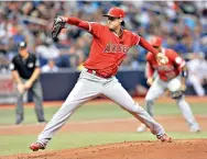  ?? AP Photo/ Steve Nesius, File ?? ■ Los Angeles Angels starter Tyler Skaggs pitches to a Tampa Bay Rays batter during the first inning July 31, 2018, in St. Petersburg, Fla.