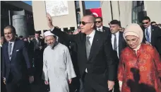  ??  ?? Recep Tayyip Erdogan with his wife, Emine, after the opening of a mosque in Cologne, Germany, on Saturday. He was later criticised for ‘hijacking the event for his political purposes’