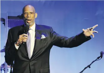  ?? CHRIS PIZZELLO, AP ?? Kareem Abdul-Jabbar addresses a Los Angeles audience in 2014. In his new book, the basketball legend writes about his early experience­s with racism and how they fuelled his embrace of Islam.