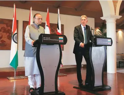  ?? REUTERS ?? British Chancellor of the Exchequer Philip Hammond (right) speaks during a joint news conference with India’s Finance Minister Arun Jaitley in New Delhi, on Tuesday.