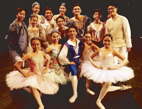  ??  ?? Joshua Rey Enciso performs the Solor variation from La Bayadere. The competitor­s with teachers Shaz and Eileen