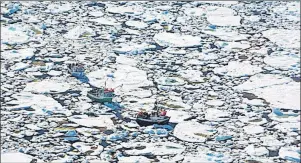  ?? CP PHOTO ?? Fishing boats are shown trapped in heavy ice off La Scie, Newfoundla­nd in a handout photo from the Department of Fisheries and Ocean. Thick Arctic pack ice had trapped multiple vessels but winds shifted to the south Thursday, freeing the vessels.