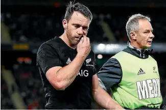  ?? HANNAH PETERS ?? Ben Smith walks off for a concussion test in the first test against the British & Irish Lions at Eden Park. He did not play again in the series.