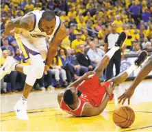  ?? Scott Strazzante / The Chronicle ?? Andre Iguodala grimaces after banging knees with the Rockets’ James Harden in the fourth quarter of Game 3.