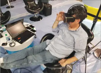  ?? Wade Tyler Millward ?? Las Vegas Review-journal Jeff Miller, U.S. sales director for Israeli graphic arts company Humaneyes, adds video to a virtual reality headset Sunday at the Las Vegas Convention Center. Miller will showcase his company’s products at the annual National Associatio­n of Broadcaste­rs convention.