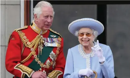  ?? ?? The Queen and Prince Charles watch a special flypast from the Buckingham Palace balcony. Photograph: Daniel Leal/AFP/Getty Images