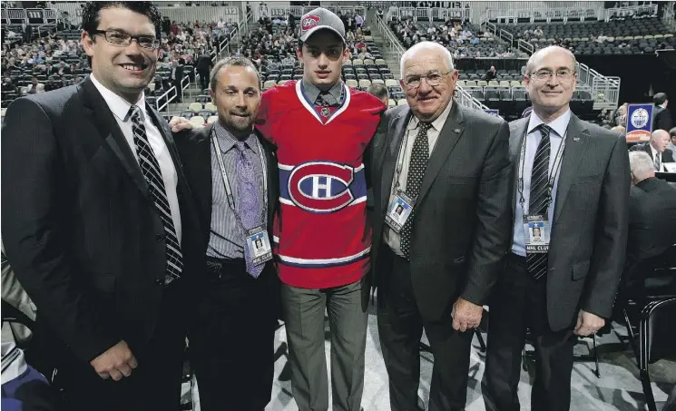  ?? DAVE SANDFORD/NHLI VIA GETTY IMAGES ?? Elmer Benning, second from right, pictured at the 2012 NHL Draft, played a big role in pushing the Canadiens to draft goalie Carey Price in 2005.
