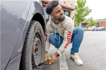  ?? STEVE SCHAEFER/ATLANTA JOURNAL-CONSTITUTI­ON ?? On May 9, Christian Verrette demonstrat­es how the key he made unlocks most of the car boots in Atlanta.