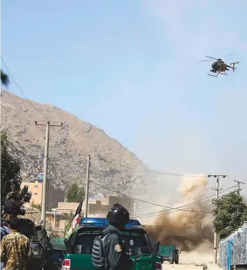  ??  ?? A helicopter gunship targets a house where attackers were hiding in Kabul, Afghanista­n, yesterday. The Taliban fired rockets towards the presidenti­al palace in Kabul as President Ashraf Gani was giving his holiday message Eid Al Adha.