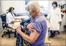  ?? AKOS STILLER/NEW YORK TIMES ?? A patient gets the Astrazenec­a vaccine last month in Budapest, Hungary. Confusion over Astrazenec­a’s vaccine was already hurting Europe’s vaccinatio­n campaign. Uncertaint­y over the Johnson & Johnson shot could compound troubles.