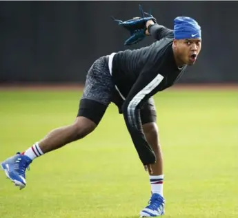  ?? NATHAN DENETTE/THE CANADIAN PRESS ?? Pitcher Marcus Stroman warms up prior to the official start of Jays spring training in Dunedin, Fla., on Monday.