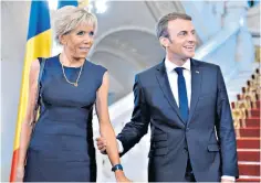  ??  ?? Emmanuel Macron and his wife Brigitte. Bills submitted by his personal makeup artist show that the president piled on £24,000 worth of make-up in just three months