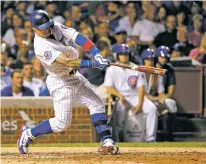  ?? CHARLES REX ARBOGAST/THE ASSOCIATED PRESS ?? Chicago’s Javier Baez hits a two-run home run off White Sox pitcher Anthony Ranaudo during the seventh inning Wednesday in Chicago.