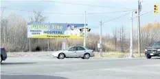  ?? MIKE DIBATTISTA /POSTMEDIA FILE PHOTO ?? A billboard stands at the corner of Lyons Creek and Montrose roads touting the 12-hectare property as the future site of a south Niagara hospital.