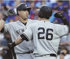  ?? AP PHOTO ?? SLUGGING IT OUT: Gary Sanchez gets congratula­tions from teammate Tyler Austin after homering in the Yankees’ 8-3 victory against the Royals last night in Kansas City, Mo.