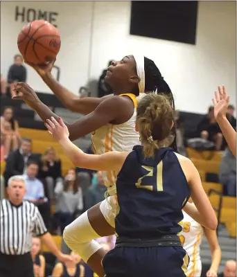  ?? PETE BANNAN — MEDIANEWS GROUP ?? Interboro junior Aniya Boland, top, goes to the basket in the first quarter of the Bucs’ game against Merion Mercy in the Lady Buccaneers Tip-Off Tournament Friday night.
