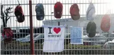  ?? PATRIK STOLLARZ/ AFP/ GETTY IMAGES ?? Caps, shirts and wishes for Michael Schumacher’s birthday hang at the karting circuit owned by Schumacher near Cologne, Germany .