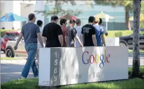  ?? PHOTO: BLOOMBERG ?? Pedestrian­s walk past a Google signage in front of the company's headquarte­rs in Mountain View, California, US. On September 27, 2013, Google celebrated its 15th anniversar­y as the company reached $290 billion market value.