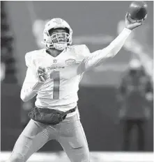  ?? ADRIAN KRAUS/AP ?? Dolphins quarterbac­k Tua Tagovailoa, seen during a Jan. 3 game against the Bills, will be an honorary official for the Dixie Vodka 400.