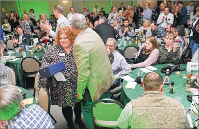  ?? STACI VANDAGRIFF/THREE RIVERS EDITION ?? Logan Russell gets a hug from former Searcy Mayor David Morris after she received the Volunteer of the Year Award on Oct. 29 from the Searcy Regional Chamber of Commerce. The 73rd annual awards banquet was at the White County Extension Office. “I love networking with people,” Russell said.