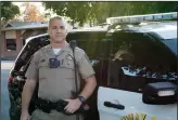  ?? CHRISTINA CORNEJO/ NEWS-SENTINEL ?? California Highway Patrol Officer Skyler Tesch stands outside of his patrol car in Downtown Lodi. He will be working on Thanksgivi­ng this year.