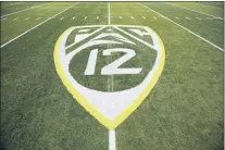  ?? RYAN KANG — THE ASSOCIATED PRESS FILE ?? A PAC-12logo is displayed on the field before a 2015game in Eugene, Ore.