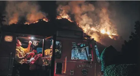  ?? Robert Gauthier Los Angeles Times ?? A FIRE ENGINE arrives in Monrovia this week to help defend Oakglade Drive homes from the Bobcat blaze, which broke out on Sept 6.