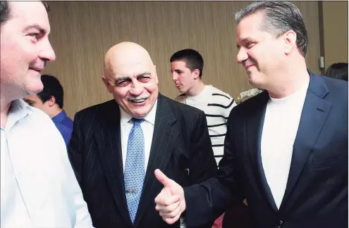  ?? Arnold Gold / Hearst Connecticu­t Media ?? From left, Tom Montelli; his father, St. Joseph boys basketball coach Vito Montelli; and University of Kentucky men’s basketball coach John Calipari are shown at a banquet at Vazzano’s Four Seasons in Stratford in 2012.