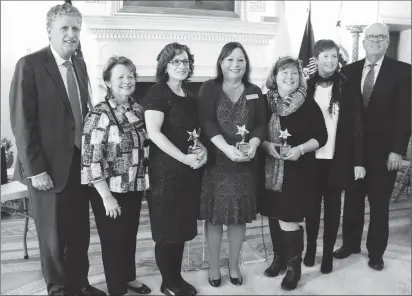  ?? Submitted photo ?? The Family Caregiver Alliance of Rhode Island recently hosted its sixth annual awards ceremony at the Statehouse. From left, Lt. Gov. Dan McKee; Kathy McKeon, Diocese of Providence; Kim Grant, caregiver award recipient; Donna McGowan, executive...