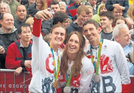  ??  ?? HOMECOMING: Double Olympic gold medal-winning rower Heather Stanning, silver medal-winning oarswoman Karen Bennett and double silver medallist canoeist David Florence take part in a selfie at a reception in Edinburgh for the Scots among Team GB’s...
