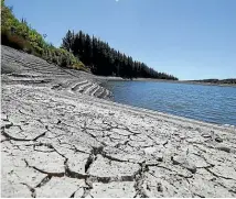  ?? MARTIN DE RUYTER/STUFF ?? The Wai-iti Valley Community Dam in Tasman district is drying out in the hot, dry conditions.