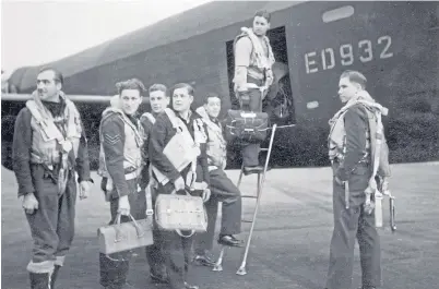  ?? Picture: PA. ?? Wing Commander Guy Gibson and his crew board their Lancaster for the famous 1943 mission that has passed into aviation folklore.