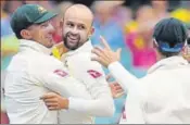  ?? AFP ?? Nathan Lyon (centre) celebrates with teammates after dismissing Alastair Cook on the fourth day of the final Ashes Test.