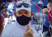  ?? SUE OGROCKI / AP 2020 ?? Kansas football coach Les Miles agreed to a settlement with the school Monday, days after being placed on leave amid sexual misconduct allegation­s from his tenure at LSU. He was hired by AD Jeff Long.