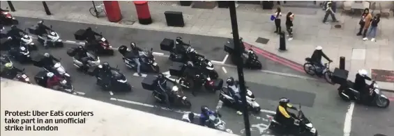  ??  ?? Protest: Uber Eats couriers take part in an unofficial strike in London