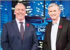  ?? The Canadian Press ?? Premier John Horgan and Liberal leader Andrew Wilkinson following the Electoral Reform Debate at Global Television in Burnaby, Thursday.