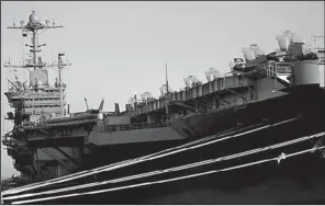  ?? AP/THE Virginian-pilot/stephen M. KATZ ?? The USS Harry S. Truman sits at Naval Station Norfolk in Norfolk, Va., on Wednesday after officials announced that the carrier’s planned mission to the Persian Gulf was being canceled as a budgetcutt­ing move, leaving only one carrier group instead of...