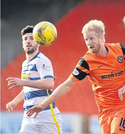  ?? Picture: SNS Group. ?? Morton scorer Lee Kilday clears from United’s Thomas Mikkelsen.