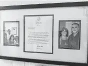  ?? HOWARD COHEN hcohen@miamiheral­d.com ?? A letter from Miami-Dade County Commission­er Lynda Bell hangs on the wall honoring the Poulos family of Lots of Lox fame at the Palmetto Bay restaurant. Bell did a ‘Work Day’ at the deli in March 2011.