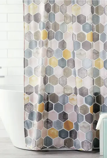  ??  ?? The hexagon shower curtain by Samantha Pynn is ideal for grey and white or grey and cream bathrooms.