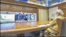  ?? PTI ?? Prime Minister Narendra Modi chairs a virtual meeting to review preparatio­ns to contain Covid-19, in New Delhi on Saturday.