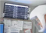  ?? John Hart, Wisconsin State Journal ?? The heart rates, blood pressure levels and oxygen levels of COVID- 19 patients are closely tracked at a hospital Thursday in Madison, Wis.