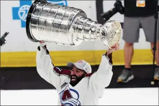  ?? AP PHOTO JOHN BAZEMORE ?? Colorado Avalanche center Nazem Kadri lifts the Stanley Cup after the team defeated the Tampa Bay Lightning 2-1 in Game 6 of the NHL hockey Stanley Cup Finals on June 26.