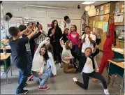  ?? GINA JOSEPH — THE MACOMB DAILY ?? Renee Kraft, at center, and surrounded by her fourth-grade students at South Lake Schools’ Elmwood Elementary in St. Clair Shores celebrate her victory as Macomb County Outstandin­g Teacher of the Year.