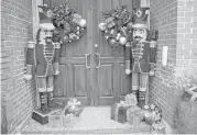  ??  ?? Nutcracker decoration­s give a preview of what’s inside Lauren Leavitt-Griffin’s home.