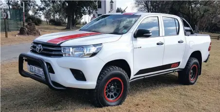  ??  ?? Custom styling kit gives this Hilux more presence. The ‘balloon’ tyres and OME suspension really smooth out the ride.