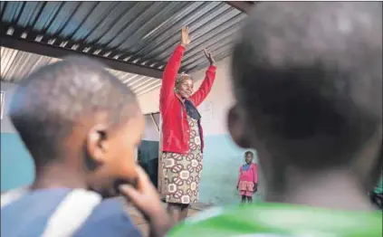  ??  ?? Above: Nobuhle Hlatshwayo (above) teaches children at the Turning Point crèche in Thembelihl­e informal settlement (left). Photos: Oupa Nkosi