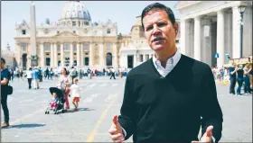  ?? AP/ANDREW MEDICHINI ?? Juan Carlos Cruz, who is the key whistleblo­wer in Chile’s clerical sex abuse scandal, talks Tuesday during an interview with The Associated Press in front of St. Peter’s Basilica in Rome.